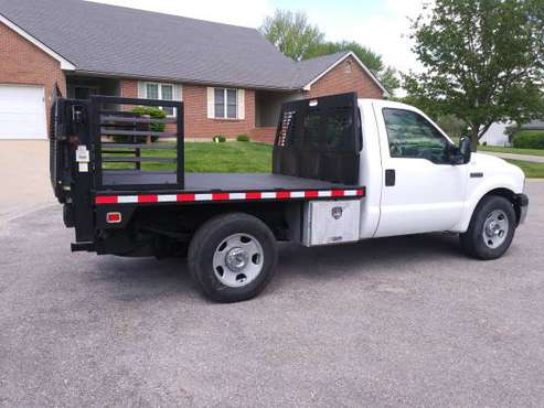 2006 FORD F350 8 STEEL FLATBED WITH TOMMY LIFT - - by for sale in KS