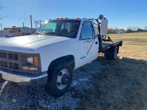 Chevy 3500 with steel flat bed Dually - cars & trucks - by owner -... for sale in Lowell, AR
