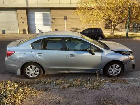 Wrecked 2014 Subaru Impreza for sale in Denver , CO