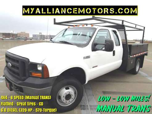 ►6 speed manual) Ford F350 Dually 4x4 (DIESEL) FLAT BED -low mile... for sale in Springfield►►(MANUAL DIESEL), MO