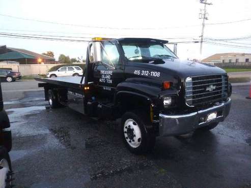 1999 Chevrolet 6500 Rollback with a 22 ft Century Steel Bed for sale in Oskaloosa, MO
