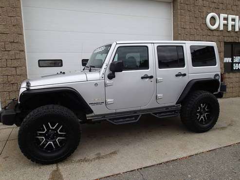2012 Jeep Wrangler Unlimited 6 cyl, auto, lifted, New 35's - cars &... for sale in Chicopee, CT