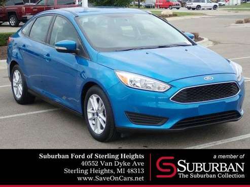 2016 Ford Focus sedan SE (Blue Candy Metallic Tinted for sale in Sterling Heights, MI