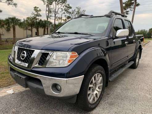 2011 Nissan Frontier SL 4x4 - cars & trucks - by owner - vehicle... for sale in Orlando, FL