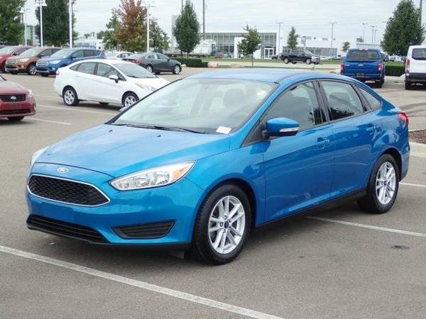 2016 Ford Focus sedan SE (Blue Candy Metallic Tinted for sale in Sterling Heights, MI – photo 4