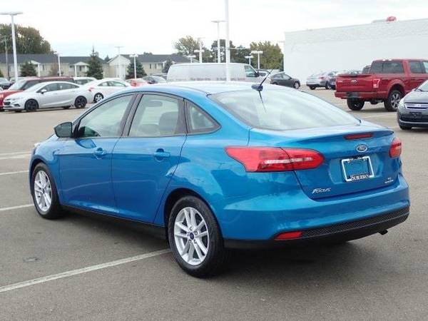 2016 Ford Focus sedan SE (Blue Candy Metallic Tinted for sale in Sterling Heights, MI – photo 6