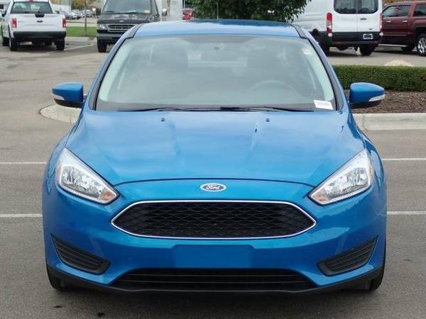 2016 Ford Focus sedan SE (Blue Candy Metallic Tinted for sale in Sterling Heights, MI – photo 3